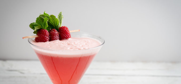 raspberry cosmopolitan martini vodka cocktail drink bar mint garnish ice bartender
